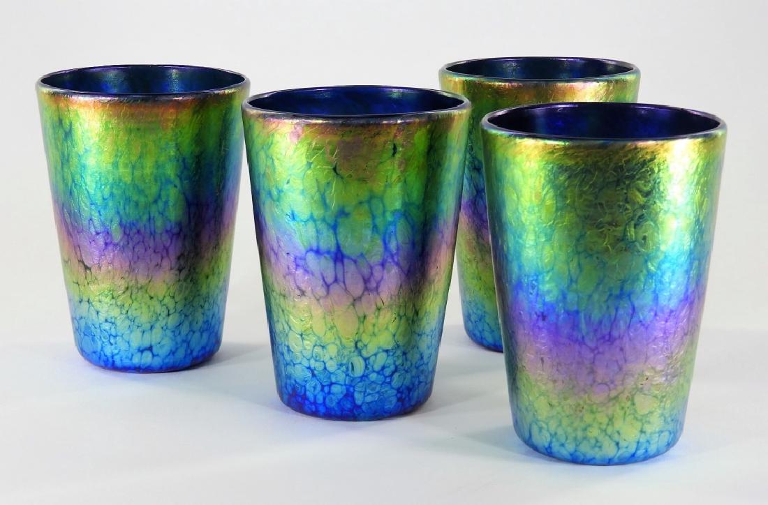 Lundberg Studios Sunset Art Glass Drinking Glasses: UNITED STATES, CONTEMPORARY A set of four Lundberg Studios Sunset I art glass drinking glasses. All four glasses are signed and dated "2003". Each measures 5" tall by 3 5/8" diameter