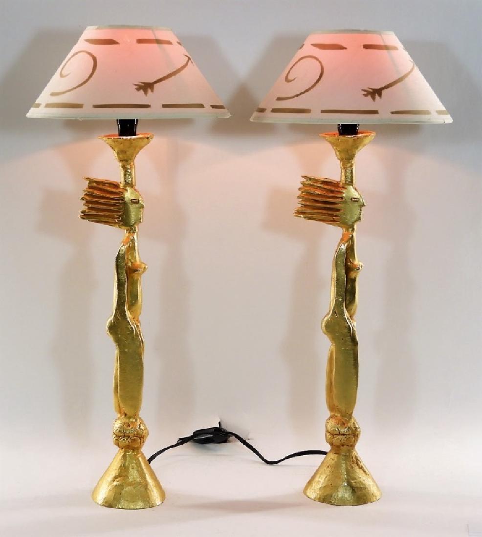 PR Pierre Casenove Gold Plated Nude Bronze Lamps: FRANCE, b.1943 A pair of gold plated bronze table lamps by contemporary artist Pierre Casenove. The lamps are in the form of a nude woman with narrow stature and static hair. The lamps retain their or