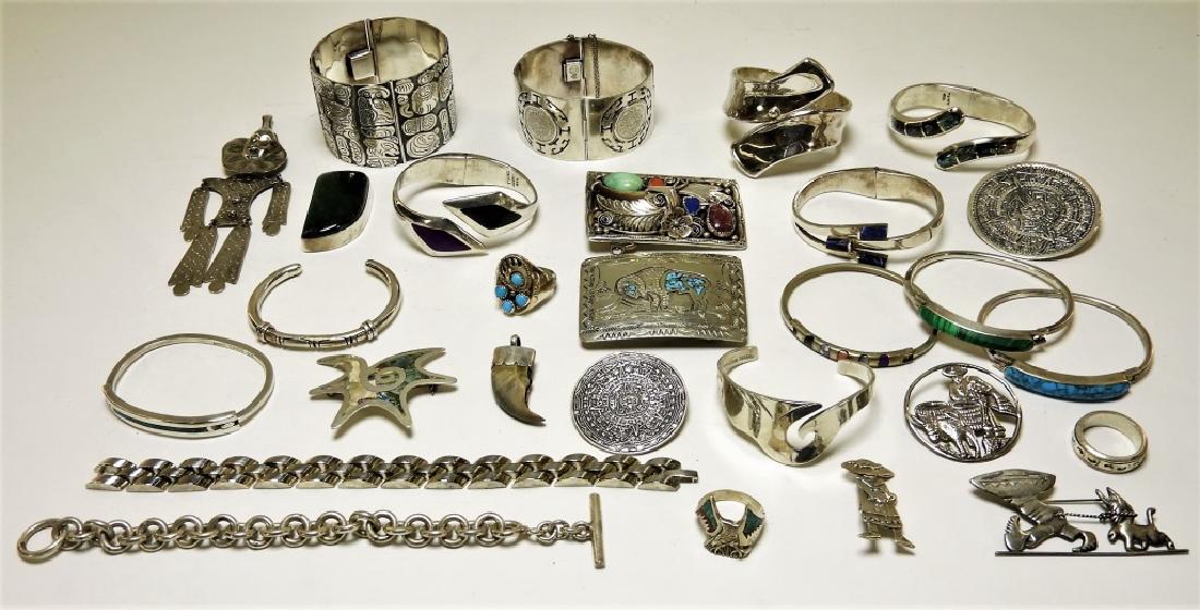 Group of Various Mexican Sterling Silver Articles: MEXICO, 20TH CENTURY A group of various Mexican sterling silver articles. The lot includes twelve bracelets, two chain link bracelets, seven pins, three rings, two belt buckles, and two pendants.