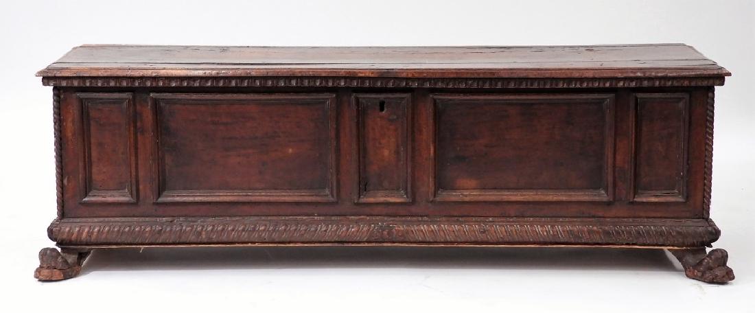 17C. Italian Carved Walnut Cassone Marriage Chest: ITALY, 17TH CENTURY An Italian carved walnut Cassone marriage chest. The chest is decorated with recessed panels and rope turn trim on paw feet. Dimensions : 22" tall by 22" deep by 68" wide