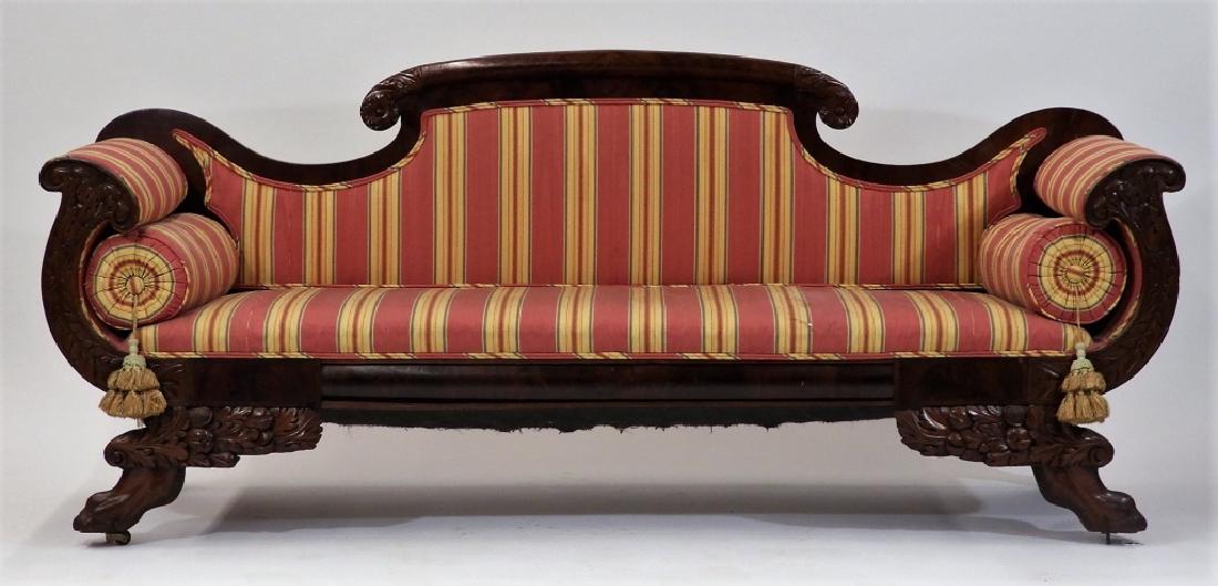 American Philadelphia Federal Carved Mahogany Sofa: UNITED STATES, CIRCA 1830 A fine American, most likely Philadelphia Federal carved mahogany sofa. The sofa stands on paw feet with acanthus leaf supports and curled arms with a shapely top rail. Dimen