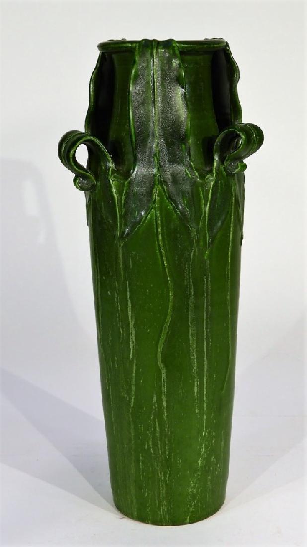 Kevin Hicks Ephraim Faience Pottery Vase: WISCONSIN, 20TH CENTURY A Kevin Hicks for Ephraim Faience Pottery matte green vase. The vase is decorated with a raised arrow root design in homage to Grueby. The underside is signed "Kevin Hicks" and