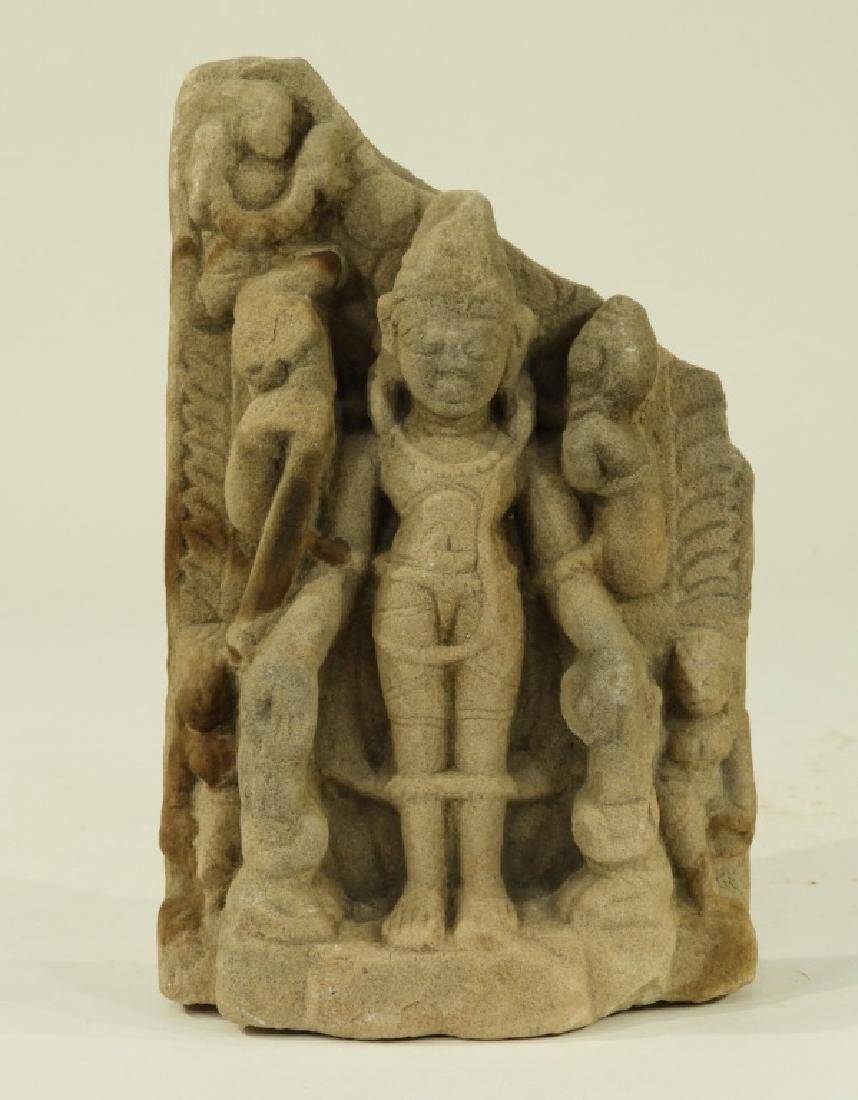 Indian Hindu Limestone Fragment Carving of Vishnu: INDIA, 14TH-15TH CENTURY An Indian Hindu limestone fragment carving of Vishnu. Vishnu is depicted standing in Samapada holding the conch and discus. Dimensions : 7 1/4" tall by 4 3/4" wide by 2" deep