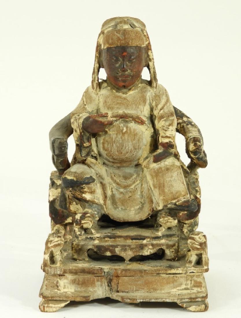 18C. Chinese Carved Lacquered Wood Figure: CHINA, 18TH-EARLY 19TH CENTURY A Chinese carved and lacquered wood figure of an official. The official is depicted seated in a throne wearing a long robe flanked by opposing Foo Dogs. Dimensions : 6 1