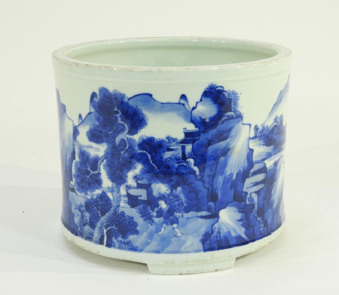 19C. Chinese Blue & White Porcelain Brush Washer: CHINA, 19TH CENTURY A Chinese blue and white porcelain brush washer. The pot is decorated with a banded hillside village scene. The washer sits on broad tripod feet and exhibits a nicely ground bottom