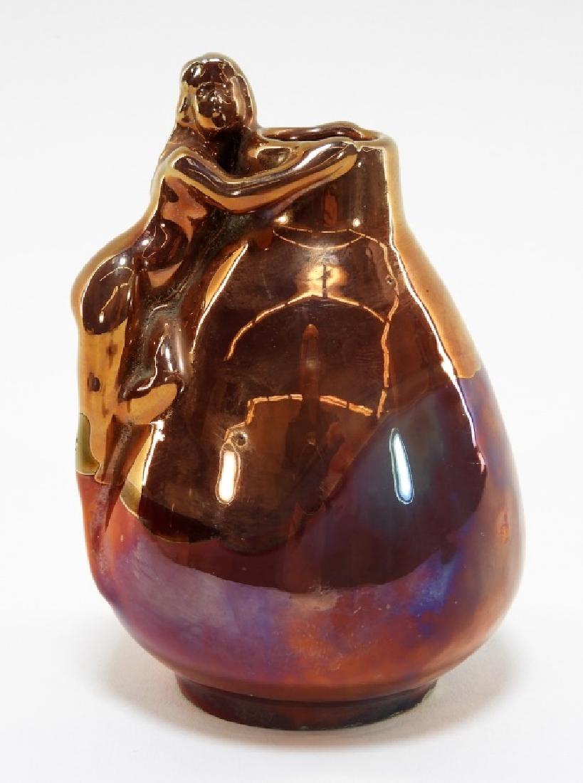 Zsolnay Art Nouveau Metallic Lustreware Vase: HUNGARY, EARLY 20TH CENTURYA small Zsolnay Art Nouveau metallic lustreware vase. The vase of bulbous form is adorned with a reclining nude and finished with a burgundy-copper lustrous glaze. The under