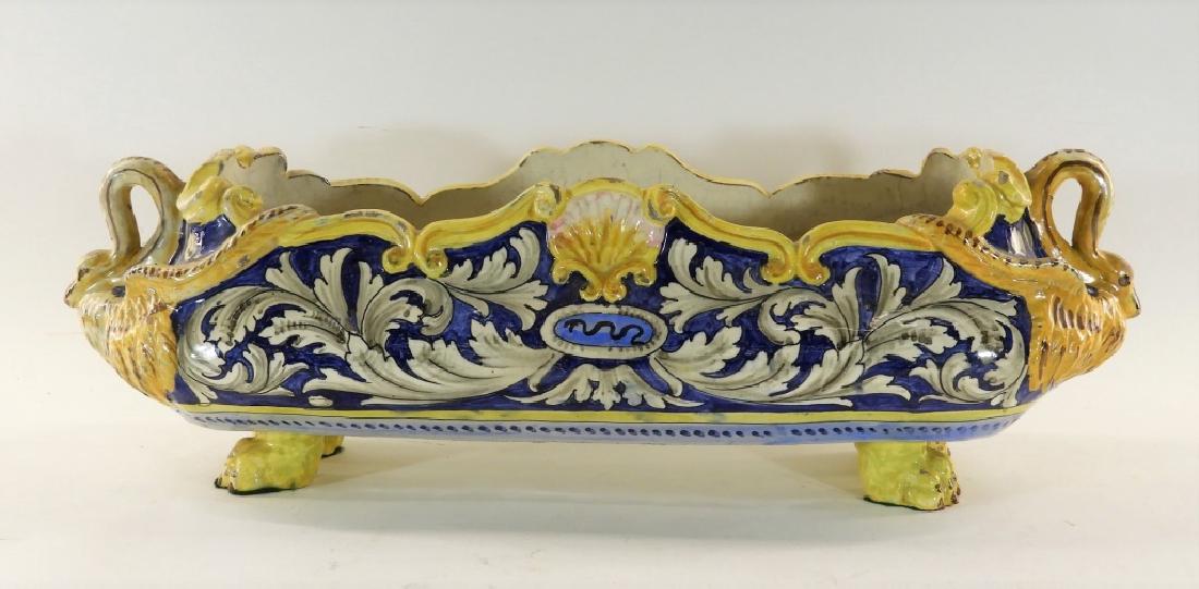 19C Italian Faience Pottery Swan Handle Jardiniere: ITALY, 19TH CENTURY An Italian faience pottery elongated jardiniere. The jardiniere stands on paw feet rising into a wide bulbous basin with shapely rim and central seashell crest adorned with figural
