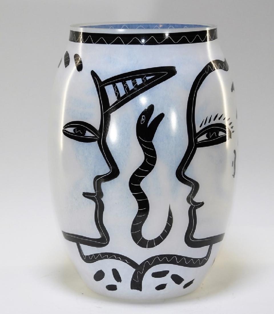Kosta Boda Adam Eve Serpent Art Glass Vase: SWEDEN, 20TH CENTURY A Kosta Boda Adam, Eve, and Serpent art glass vase. The underside bears an incised signature with numerals. Vase retains original sticker. Vase measures 13 1/2" tall, 7 1/4" diame