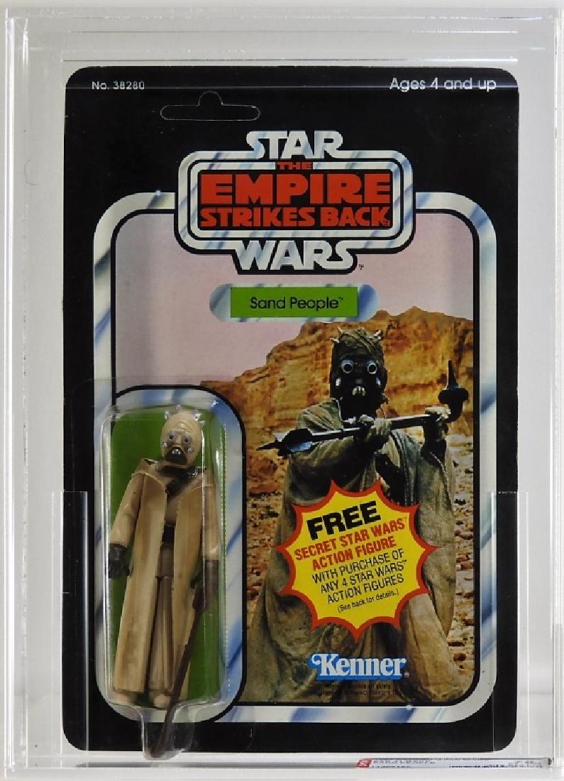 1980 Kenner Star Wars ESB Sand People AFA 75: UNITED STATES, 20TH CENTURY A 1980 Kenner Star Wars Empire Strikes Back 21 back Sand People. The card is unpunched. OVERALL GRADE: 75 EX+/NM (C:75 B:80 F:70) SERIAL NUMBER: 11207180 AFA case measures