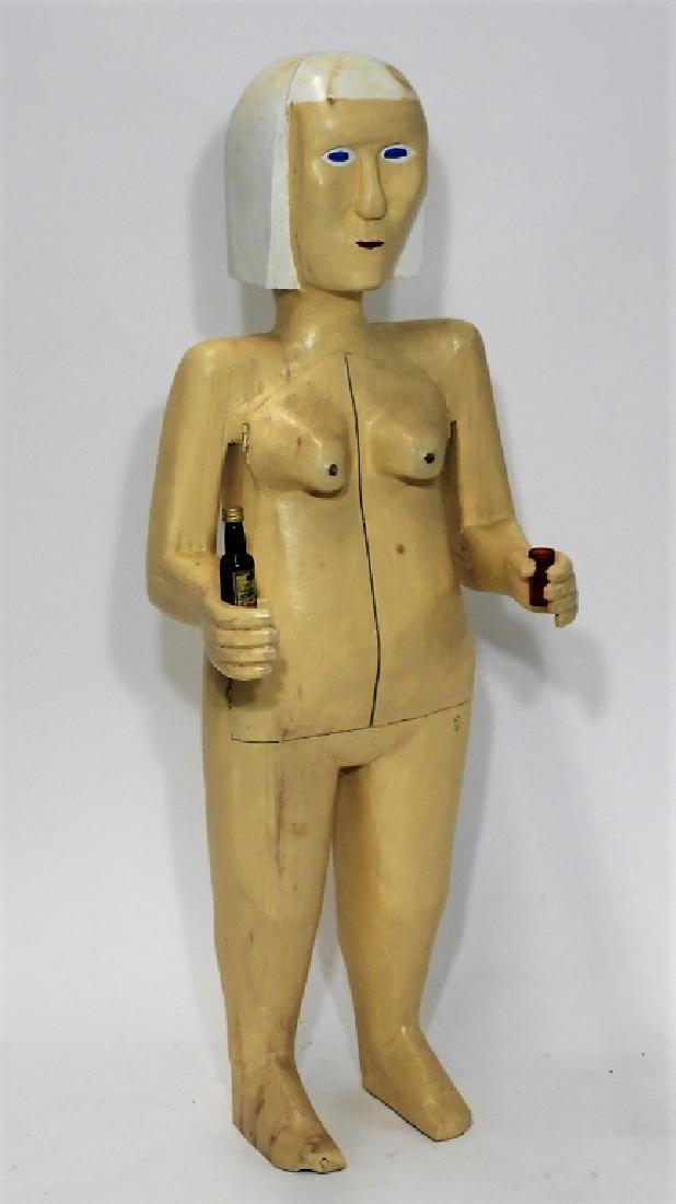 Bubby Moores Folk Art Nude Female Bar Sculpture: Bubby Moores United States,20th Century Carved wood standing female figure holding liquor with opening chest for bar storage. Signed "Bubby Moores", dated "1994", and annotated "Milton N.S" on undersi