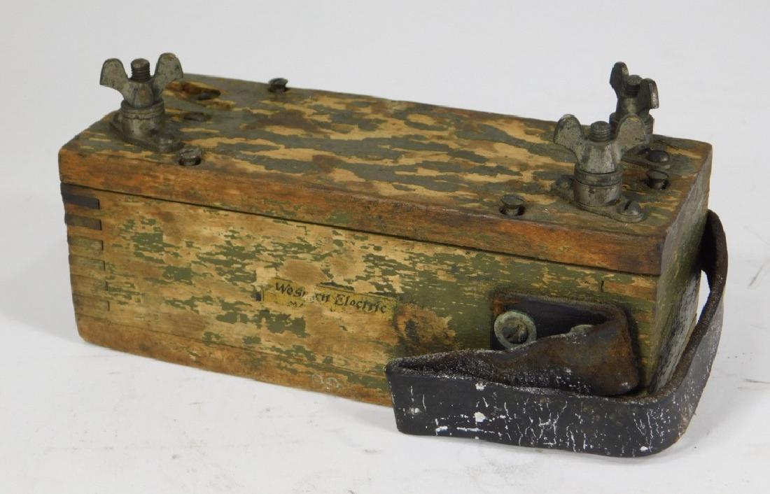 Western Electric Green Painted Wood Circuit Box: United States,Early 20th Century Retains partial decal and original green paint. Partial "Western Electric" decal. 6 1/2" x 2 5/8" x 2 1/2",Wood, leather, metal