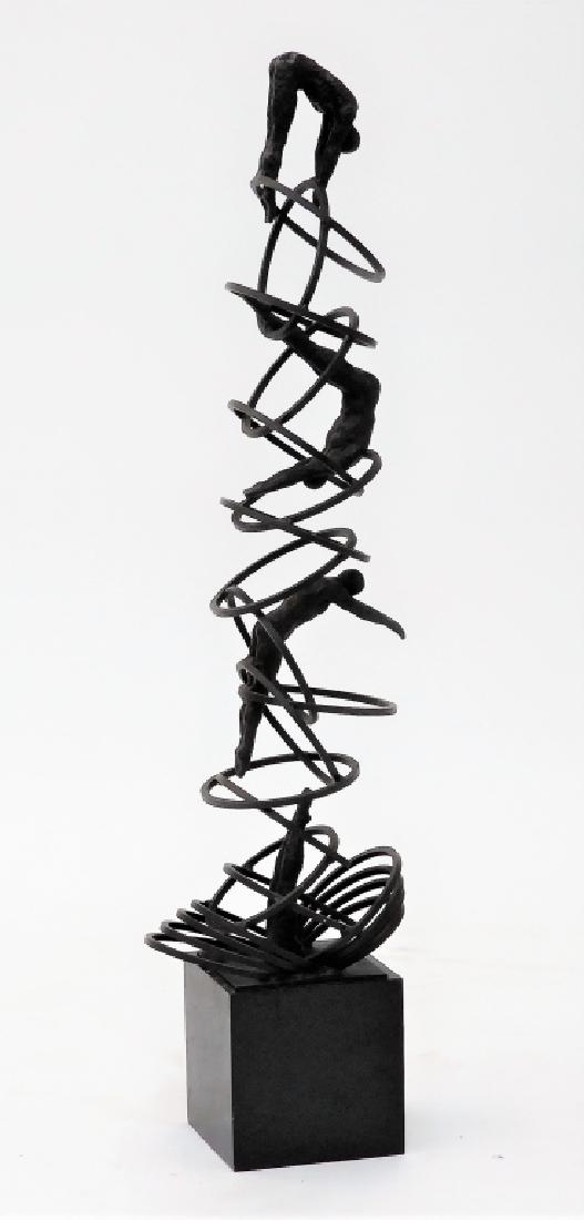 Attrib. Richard MacDonald Kinetic Bronze Sculpture: California,b.1946 Modernist figurative work capturing the motions of a diver jumping through interconnected rings. The sculpture will spring back and forth when moved. Bronze,Sculpture 39 1/2",Overall