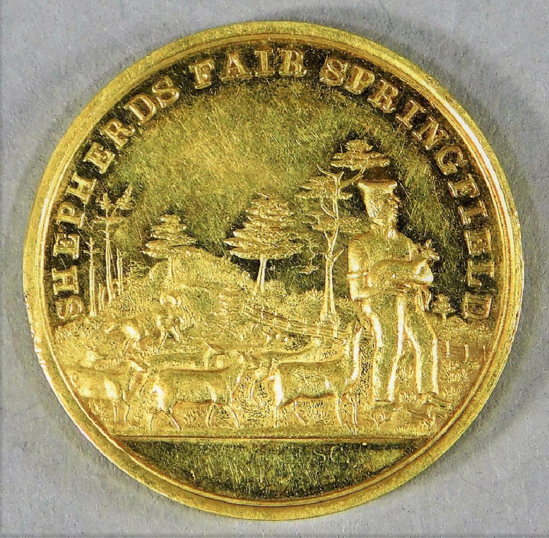1848 Shepards Fait Springfield Award 18K Gold Coin: ,United States,1848 Awarded to Henry T. Kirkland for superior clip clothing wool, obverse decorated with a farmer carrying a small deer as several other follow them. 18K Gold,1 1/18" dia.,Total weight