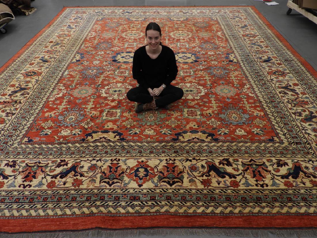 Oriental Pakistani Sultanabad Hand Knot Carpet Rug: ,Persia,Semi Antique (Post 1940) Large central field of geometric flowers surrounded by a wide ivory border of linear and floral designs. Wool,17'6" x 15'1", From a Cape Cod, Massachusetts estate.