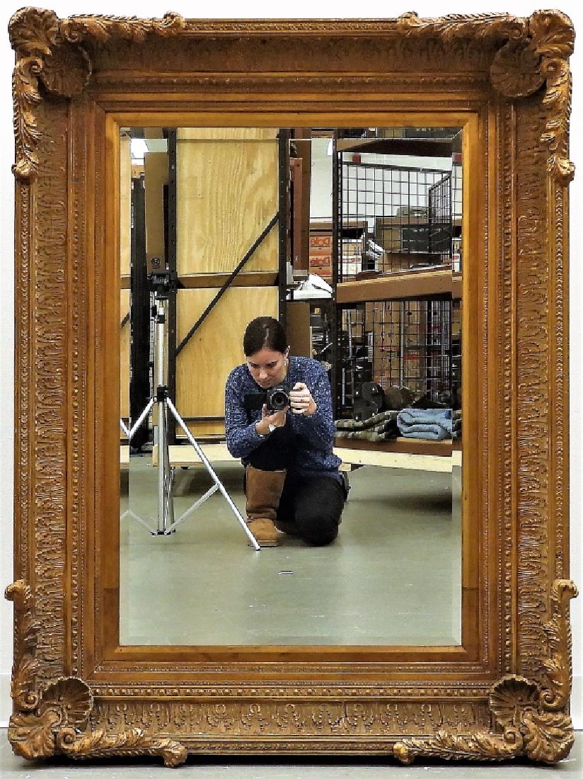 LARGE Gilt Acanthus Leaf Beveled Glass Mirror: ,Europe,20th Century Elegant mirror with thick stylized acanthus leaf frame with heavily molded corners. Glass, plaster, & wood,Overall 49 1/2" x 37 3/4", From the collection of a Warwick, Rhode Islan