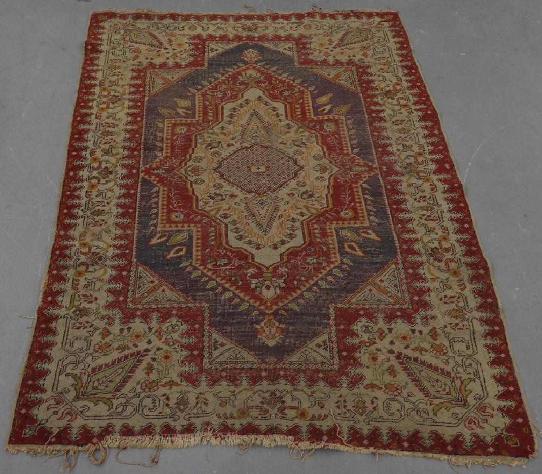 C.1900 Turkish Oushak Middle Eastern Carpet Rug: ,Turkey,Circa 1900 Central ivory medallion within a shaped red and purple border within a floral and tendril border with palmet indented corners. Wool,6'9" x 4'7", From the collection of an Uxbridge, 