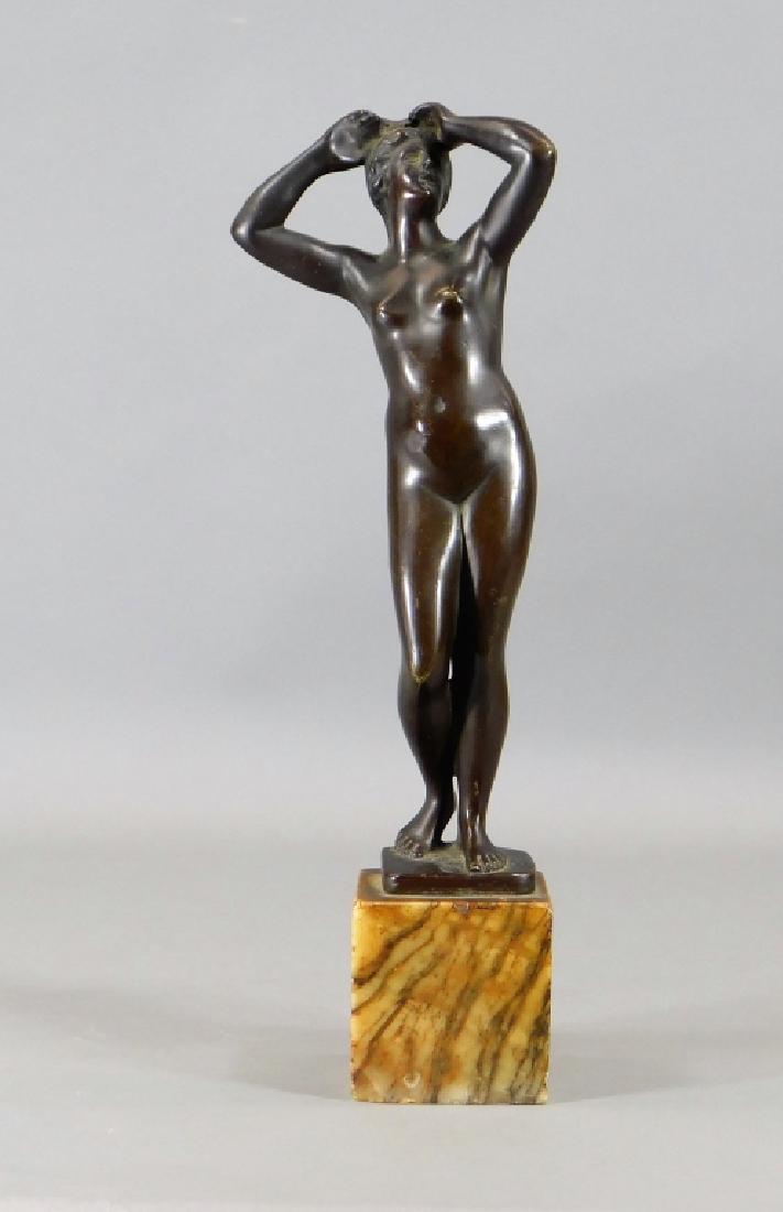 French Neoclassical Bronze Model of a Nude Woman: ,France,Early 20th Century Classically modeled standing nude female figure in contrapposto, mounted on a siena marble base. Bronze,12" tall with base, Signed "Cartinet" on bronze base. From the collec