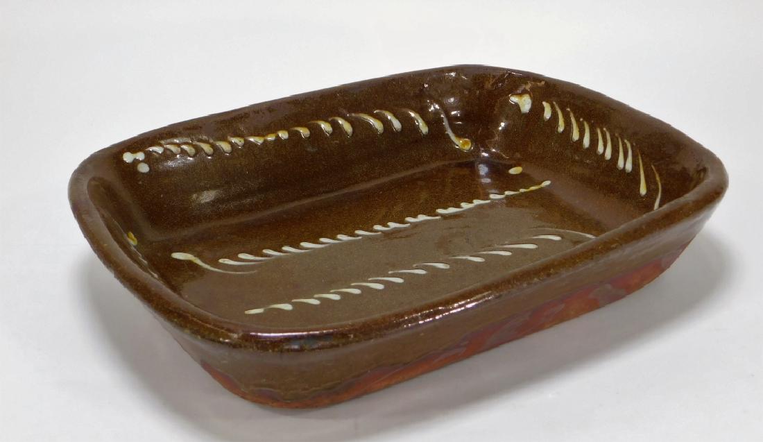 19C English North Country Slip Ware Roasting Dish: ,England,Early 19th Century Rectangular form decorated with a stylized feather design in a white over brown glaze. Redware,14 1/2" x 11" x 3" tall, From the collection of a Bristol, Rhode Island gentl