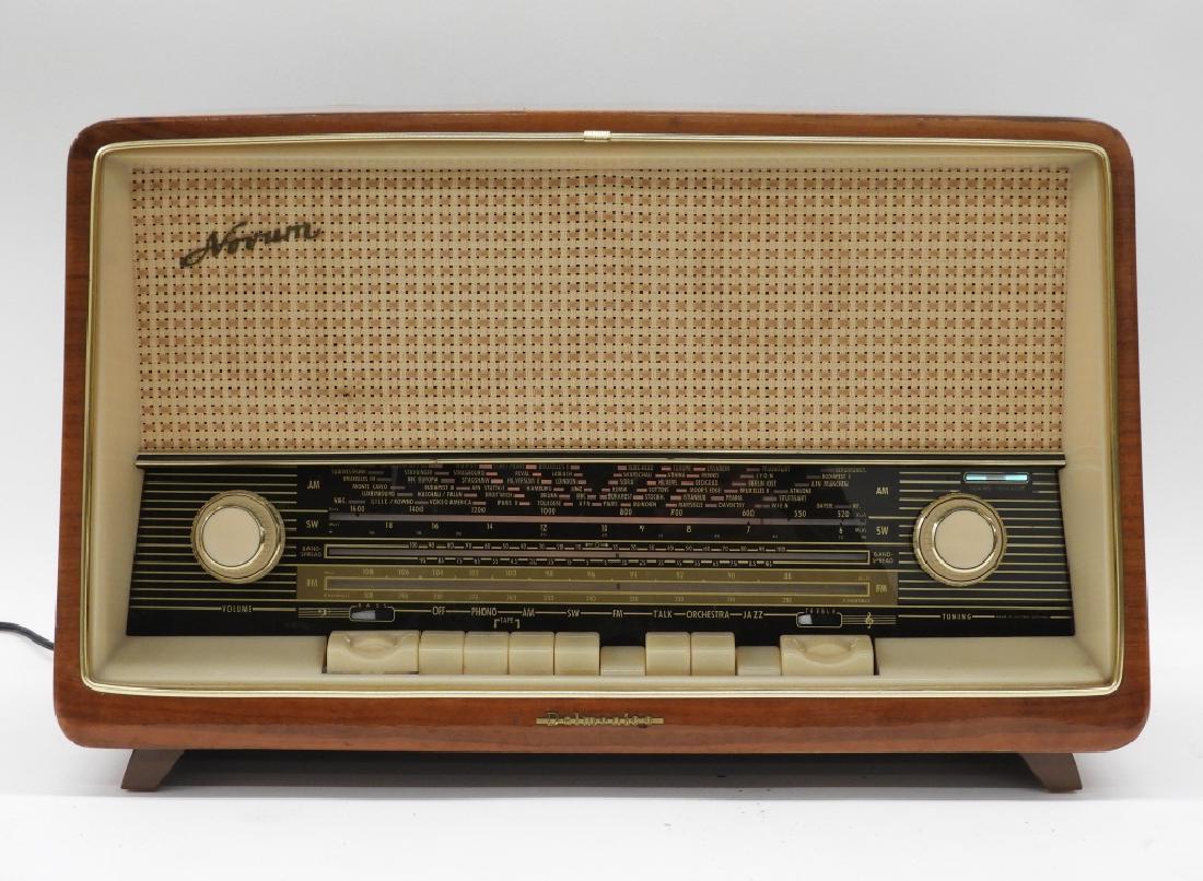 Korting for Delmonico Int Novum AM/FM Radio Stereo: ,Germany,Circa 1950 Novum AM/FM radio stereo manufactured by Korting Radio Werke of Western Germany for Delmonico International Company. Wood, metal, and plastic,13" tall x 20" wide x 9" deep, From th