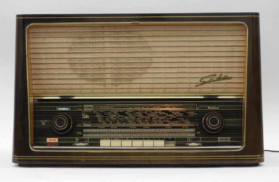 German Saba Wildbad 9 AM/FM Radio Deco Stereo: ,Germany,Circa 1950 Wildbad 9 AM/FM radio manufactured by Saba. Wood, metal, and plastic,14 1/2" tall x 24" wide x 10" deep, From the collection of a Westport, Massachusetts gentleman.