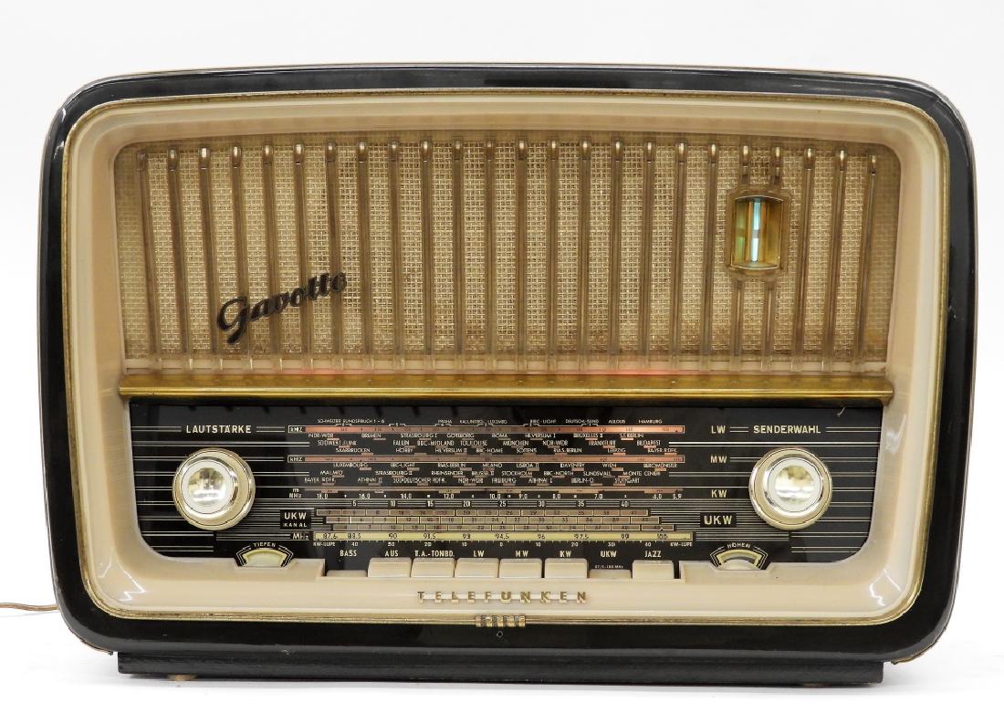 Telefunken Gavotte 1153 AM/FM Sunburst Deco Radio: ,Germany,Circa 1950 Welchselstrom-Super Gavotte 1153 radio manufactured by Telefunken, Germany. Wood, plastic, and metal,12" tall x 17 1/2" wide x 8 1/2" deep, From the collection of a Westport, Massa