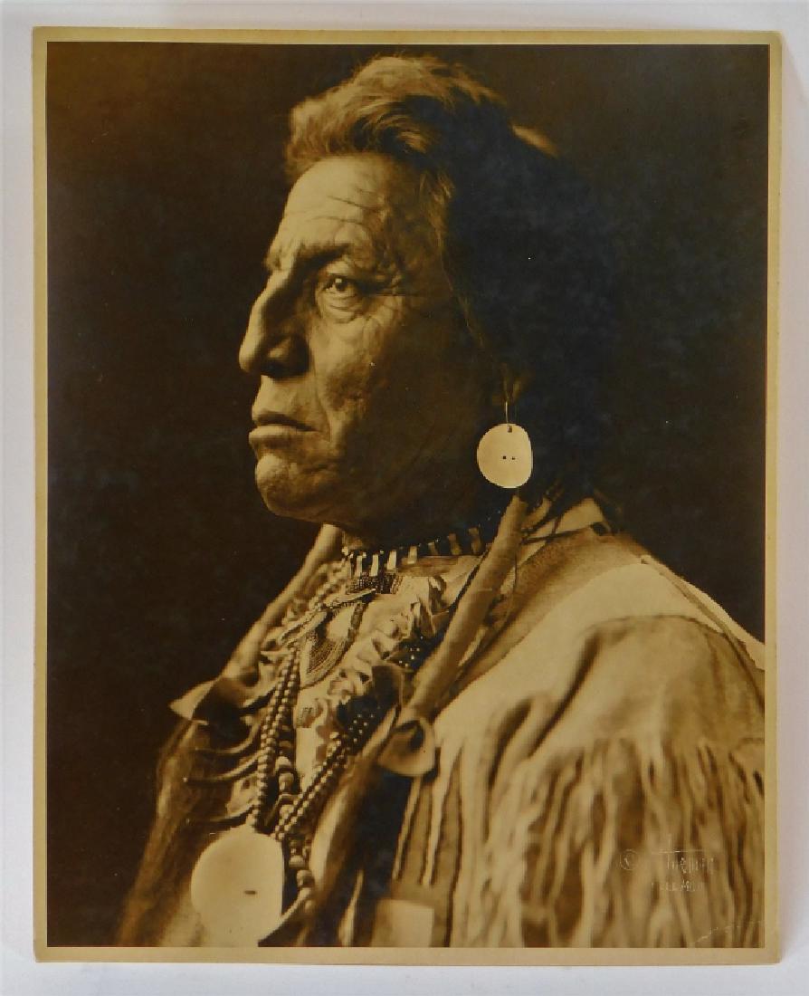 T.J Hileman Chief Two Guns Glacier Park Photograph: Tomar Jacob Hileman,Pennsylvania,1882-1945 Original photograph of Native American Chief Two Guns White Calf, Glacier Park Photo Shop, Montana stamp on verso. Photograph on paper,9 3/4" x 7 1/2", Signe