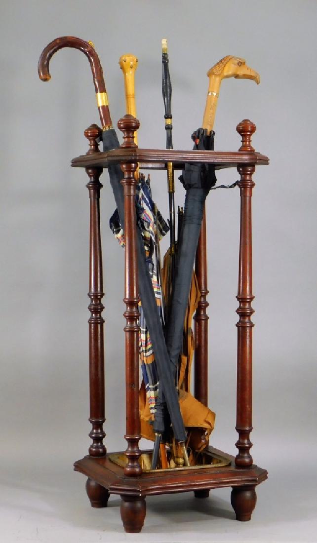 C.1870 Victorian Mahogany Umbrella Stand: ,Massachusetts,Circa 1870 Shaped rectangular form with turned columns supporting a C. Blake of Boston, Massachusetts cast iron drip tray. The stand comes with four umbrellas for display. Cast iron, wo
