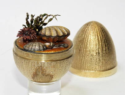 Stuart Devlin Gilt Sterling Silver Surprise Egg: Stuart Devlin,England,20th Century # 183 and decorated with shells on the sea floor. Silver,3" tall, Signed "SD" on base.