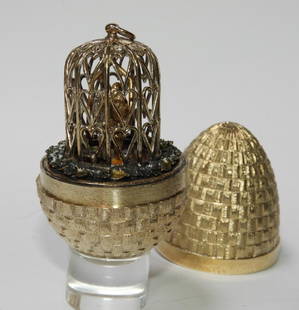 Stuart Devlin Gilt Sterling Silver Surprise Egg: Stuart Devlin,England,20th Century # 178 and decorated with love birds in a cage. The cage decorated with hearts. Silver,3 " tall, Signed "SD" on base.