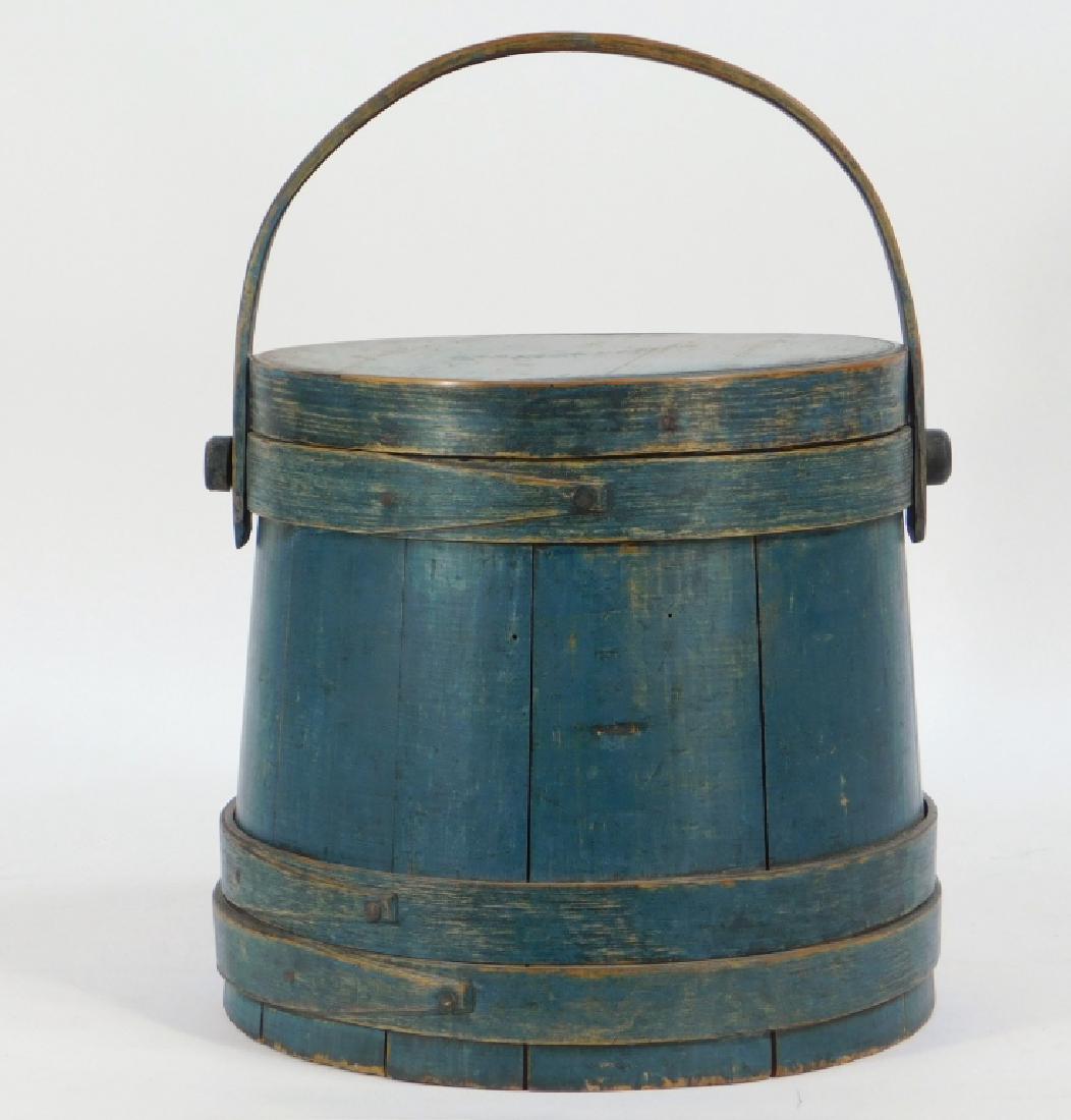 C. Wilder & Sons Hingham Blue Painted Wood Firkin: ,Massachusetts,19th Century Copper nail construction finished in old blue paint.,Wood,10 1/2" dia.x 9 1/4" tall, Marked "C. Wilder & Sons Hingham" on lid. Marked "Newell Boyd" on bottom. From the coll