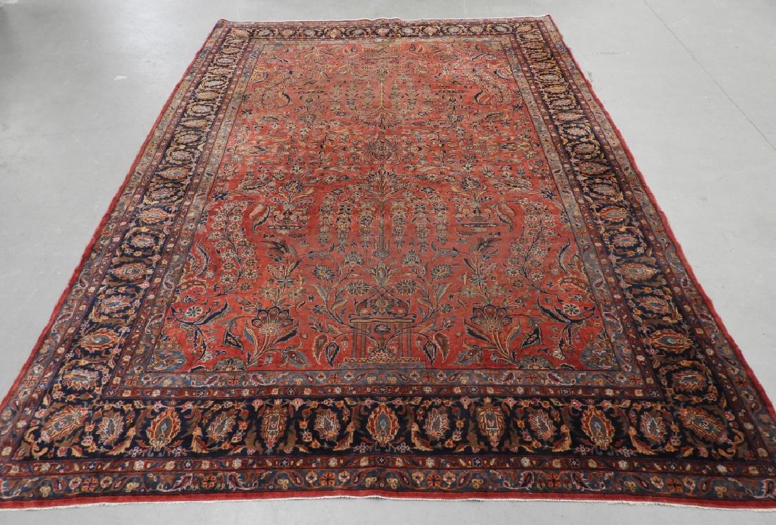 Antique Persian Keshan Wool Carpet Rug: ,Persia,CIrca 1910 Central red field with repeated floral and tendril design surrounded by wide stylized floral border in blues and red.,Wool,11' 8" x 8' 8", From a Cape Cod, MA estate.