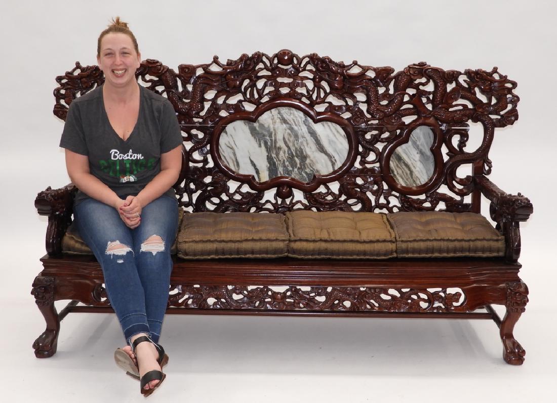 Chinese Carved Hardwood Marble Mountain Sofa: China,20th Century Sofa carved with dragons chasing a pearl amongst clouds with a marble mountain scene tile inset over a hardwood solid seat flanked by arms terminating into dragon heads on ornate st