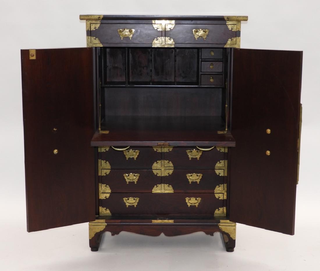 Korean Asian Carved Hardwood Tansu Chest: Korea,20th Century Two drawers with center opening compartment with secretary desk upon five drawers with brass hardware. Wood,52" t x 36" w x 16" d, From the collection of an East Greenwich, Rhode Is