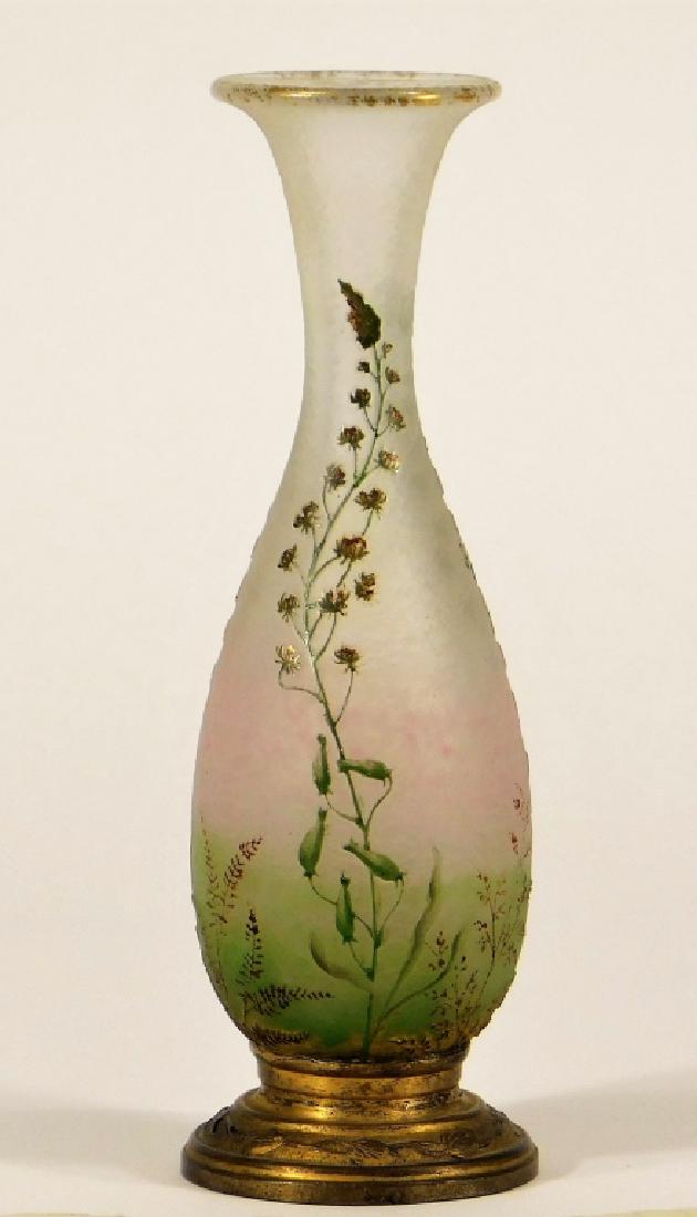 FINE French Daum Enameled Cameo Glass Vase: France,Early 20th Century Diminutive amphora form with corsetted neck and flared rim in a gradient pink to green then opaque glass with cameo cut florals with enameled details, mounted in a gilt repou