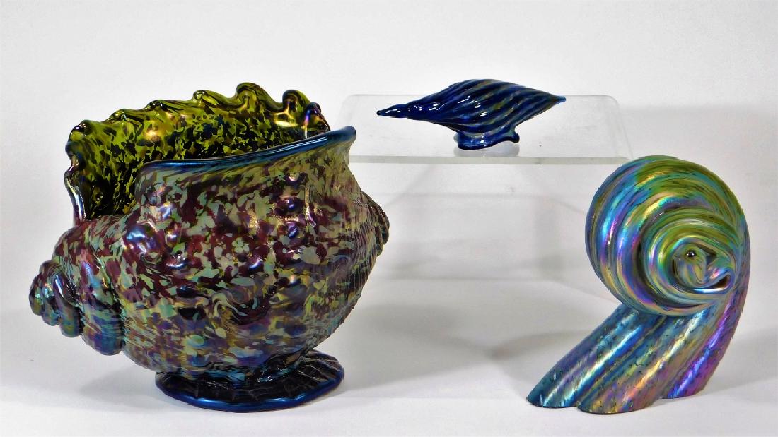 3 Nautical Marine Shell Art Glass Sculptures: United States,20th-21st Century Includes a large conch shell, heavy solid spiral iridescent shell, and a small blue spiral shell. Glass,Largest 7 3/4" long,Smallest 5 3/8" Iridescent shell signed ille