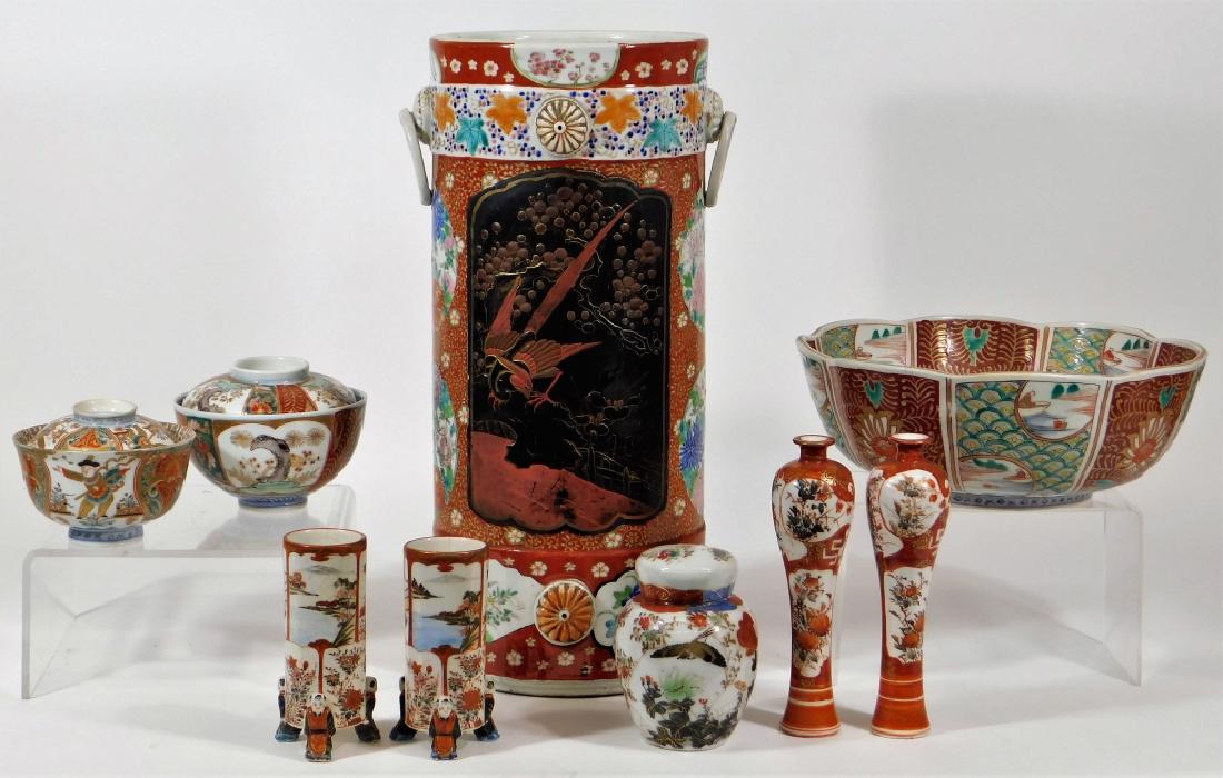 10 Antique Japanese Kutani Porcelain Bowl Vase Cup: Japan,19th-20th Century Group includes a 15 1/2" cylinder vase with clobbered lacquer decoration, 10" dia. lobed center bowl, 7" pair of slender vases, 4 7/8" pair of figural footed cylinder vases, 4 