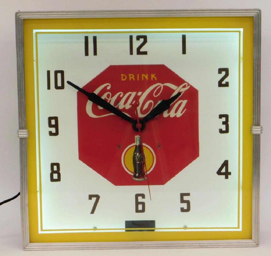 Synchron Neon Coca-Cola Advertising Clock: United States,20th CenturySquare face with flat glass reading "Drink Coca Cola" with iconic bottle below.Metal and glass,15 1/2" x 15 1/2",From the collection of Russell Buteau, Millville, Massachuset