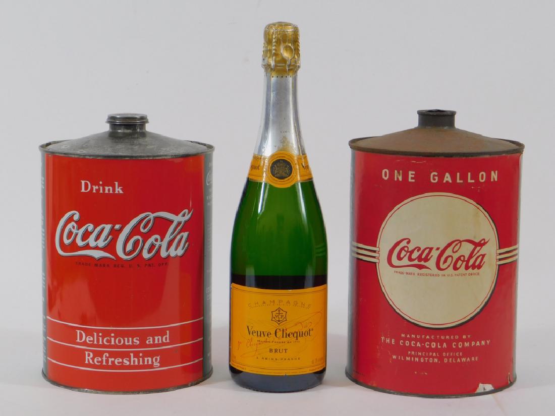 C.1945 Coca-Cola 1 Gallon Tin Syrup Cans: United States,Circa 1945 Two similar paper label cans, the left from the 1940's, right 1950's. Tin,9 1/2" tall x 6" in diameter, From the collection of Russell Buteau, Millville, Massachusetts. Life l