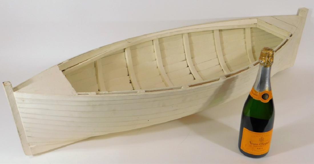 Carved Painted Wooden Shiplap Dory Boat Model: United States,Mid 20th Century Hand made in the mid 20th Century this scale model boat has bent wood inner rib reinforcement supports, shiplap skin boards and is of overall fine quality. Wood,42 1/2" 