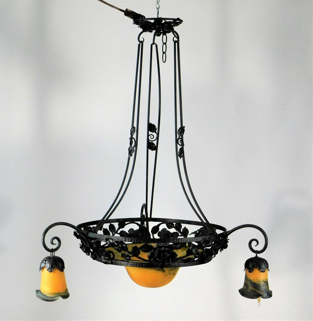 Muller Freres Art Nouveau Art Glass Chandelier: ,France,20th Century Three arms, four bulbs with elaborate wrought iron rose and vine center rail, black and orange striated art glass shades. Attributed to Muller Freres, Luneville France. Iron, glas
