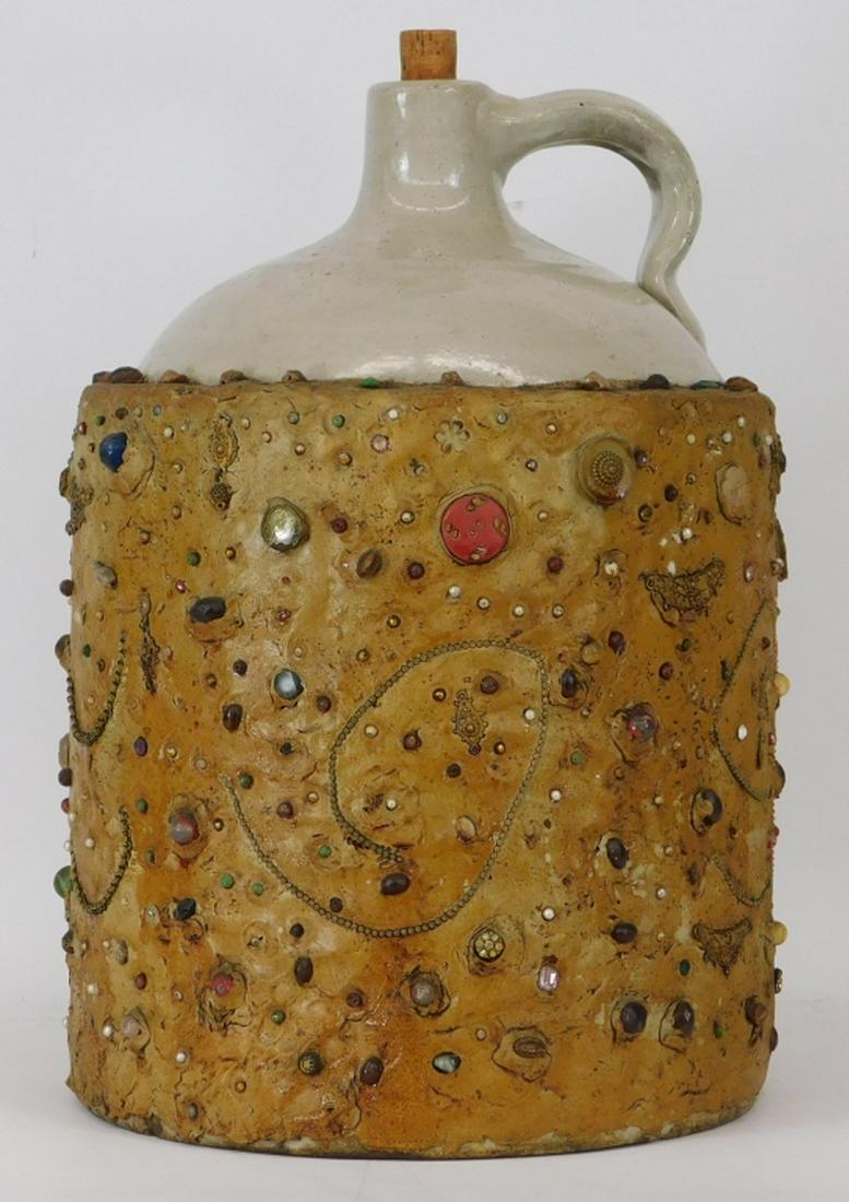 LARGE 20C American Primitive Folk Art Memory Jug: ,United States,20th Century Heavily embellished with beads, shells, and metal findings. This style of jug is believed to have origins in Africa's Bakango culture which was later brought to America dur