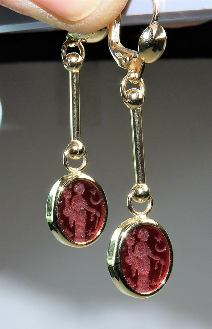 PR 14K Gold Intaglio Cut Red Cameo Glass Earrings: ,Italy,20th Century 14K yellow gold drop earrings with red intaglio cut glass with standing figure. Weight as seen for the pair 4.6 grams. 14K gold, glass,1 1/2" long, From the estate of an Attleboro,