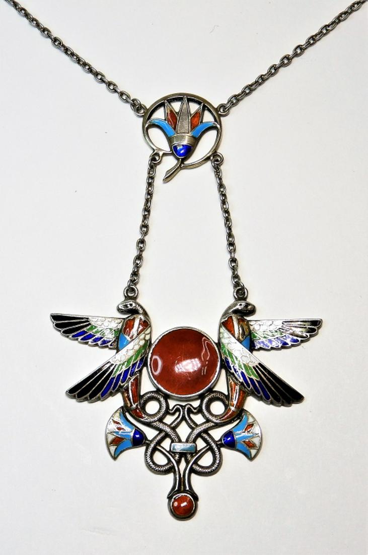 Egyptian Revival .800 Silver Bird Snake Necklace: ,Europe,20th Century .800 silver and enamel Egyptian revival necklace with bird and snake motif. Weight as seen 20.1 grams. .800 silver, enamel,Pendant lower section 2" x 2 1/2",Chain 16" From a Fairh