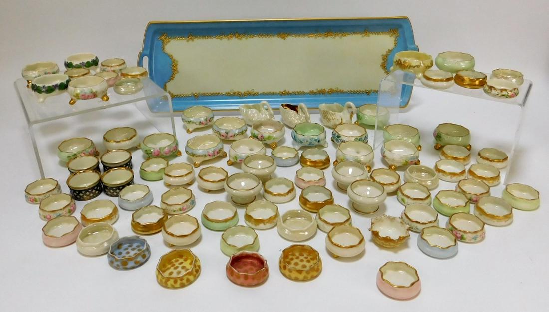 85PC American Belleek Assorted Salt Cellars: ,United States,20th Century Collection of various salt cellars and a rectangular robin's egg blue and white tray with gilt floral decoration. Porcelain,Smallest 1/2" x 1 3/4",Largest 6" x 19" From the