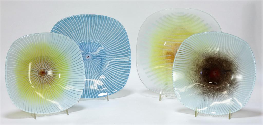 4PC Maurice Heaton Square Plate Art Glass Group: United States,20th Century Includes two small square plates with white line decoration and two medium plates, one with a circle design and the other with a blue linear decoration. All marked "H. M." F