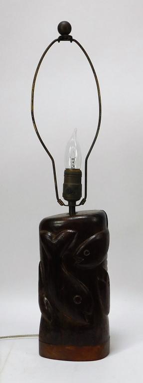 Nicholas Mocharnuk Carved Wood Fish Lamp: Nicholas MocharniukNew York,b.1917 Ovoid form carved with a school of fish in high relief wrapping the body of the lamp. Signed "NIMO" on side. From the collection of a Medfield, Massachusetts gentlem
