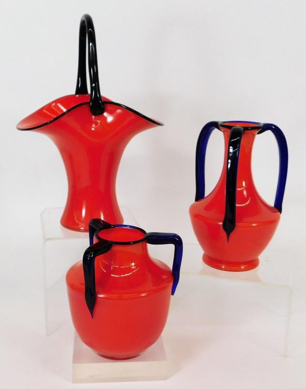 3PC Michael Polowny Loetz Tango Glass Red Vases: Michael PolownyAustria, Czechoslovakia,1871-1954 Includes a basket form with black handle, low choke vase with three rounded blue handles, and a squat vase with angular blue handles. Two of three vase