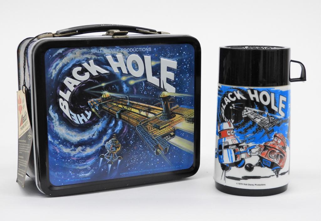 Aladdin The Black Hole Disney Lunch Box & Thermos: United States,1979 An Aladdin The Black Hole metal lunch box with matching plastic thermos. Includes original thermos instruction tag. Lunch box 8" x 6 7/8" x 3 3/4",Thermos 6 1/2" x 3 1/2" diameter