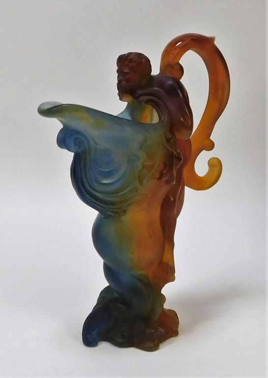 Daum France Pate de Verre Art Glass Figural Ewer: France,Early 20th Century Classical dolphin form body with figural Greco-Roman male nude handle looking into the mouth of the dolphin executed in amber-blue glass. Glass,Overall 12" x 8 1/2", Marked "