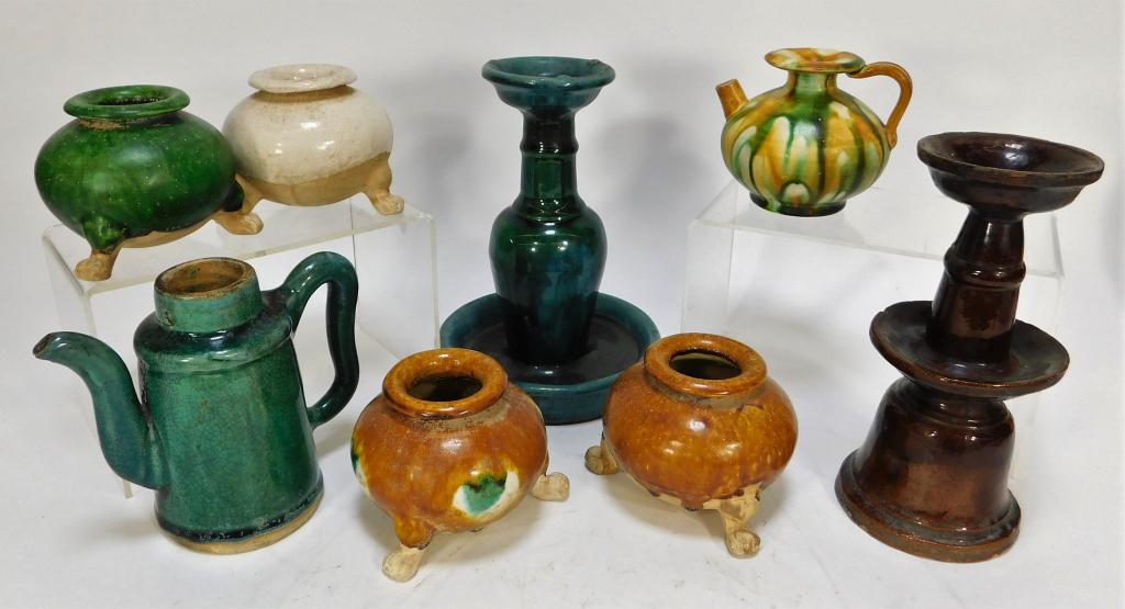 8PC Chinese Sawankhalok Pottery Candlestick Group: China, Thailand,12th-13th Century or Later Assorted collection of antique Chinese and Thai pottery including four Sancai glazed vessels in orange, green and white, two candlesticks in brown and turquo